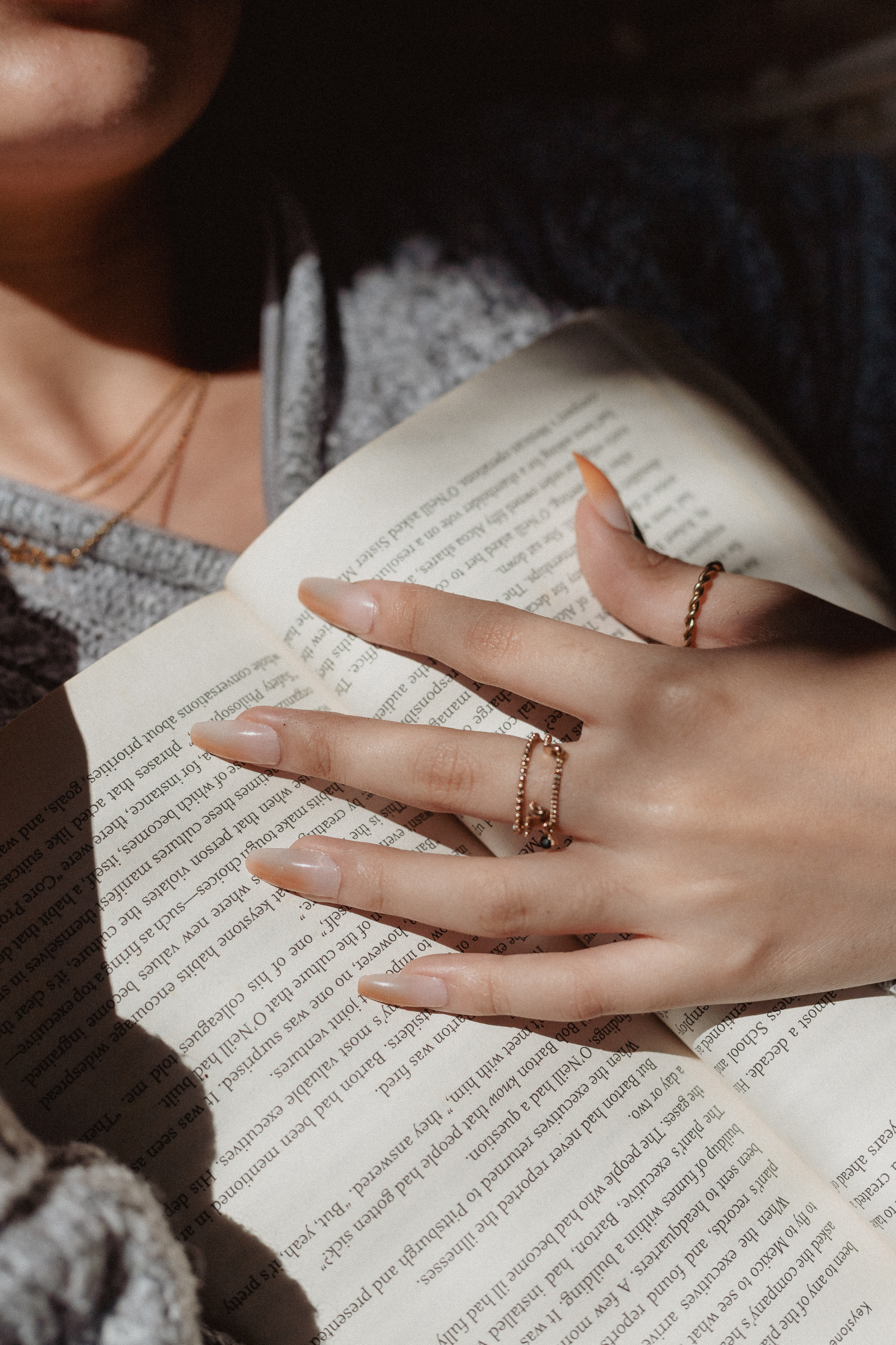 Woman with Open Book on Chest